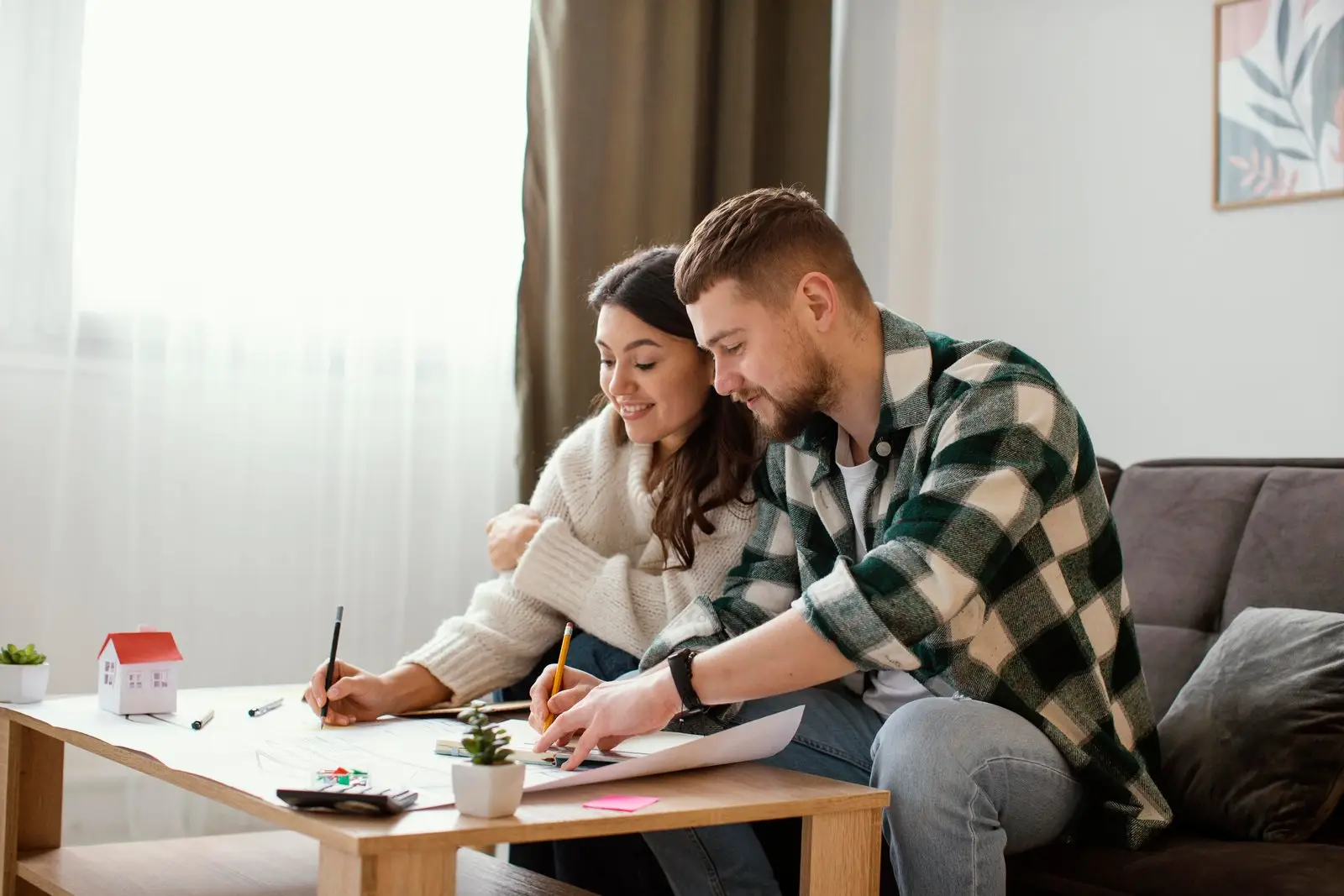 medium shot couple sitting couch